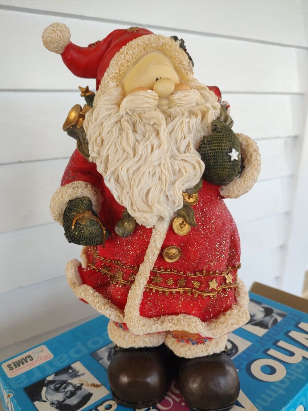 Studio 33 resin Santa Claus Christmas figurine, typically measuring 9 inches tal
